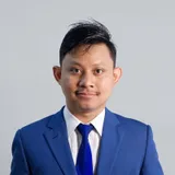 Ariff Azman in a blue suit, studio portrait